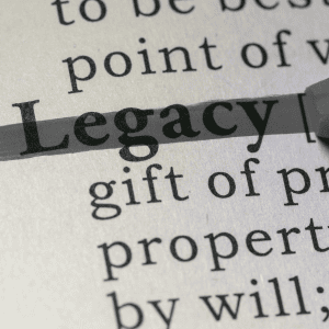 Dictionary entry for 'legacy' highlighted and emphasized, symbolizing Optimum Transitions' commitment to preserving business legacies, company culture, and lasting value for all stakeholders
